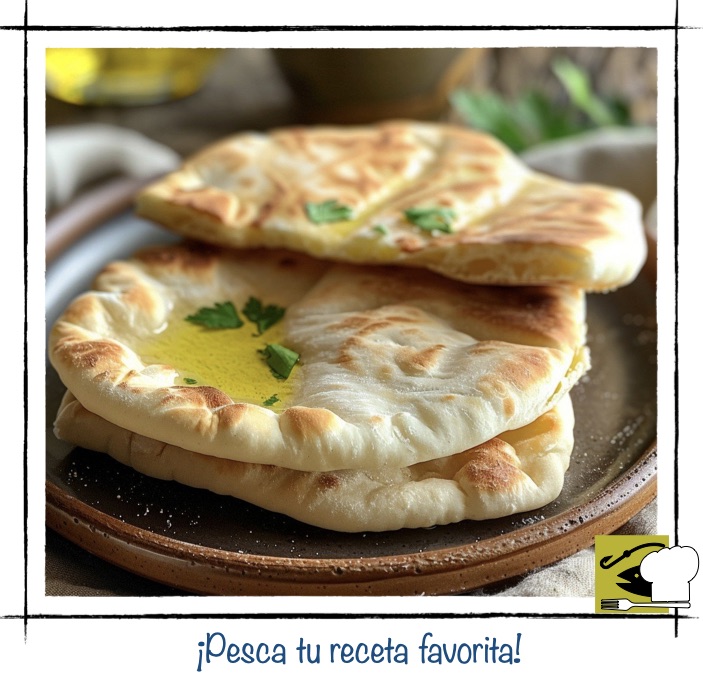 Panes planos caseros tipo focaccia o naan bañados en aceite de oliva y hierbas frescas, una base perfecta para bocados marinos.